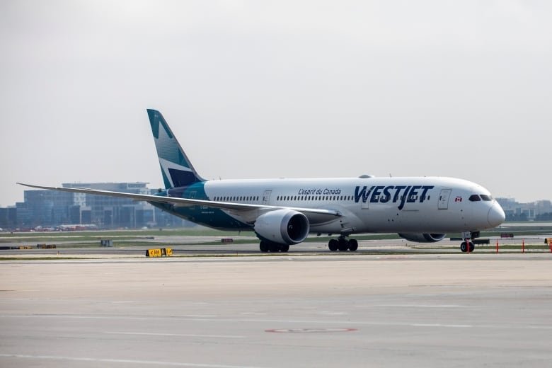 A WestJet plane is seen.