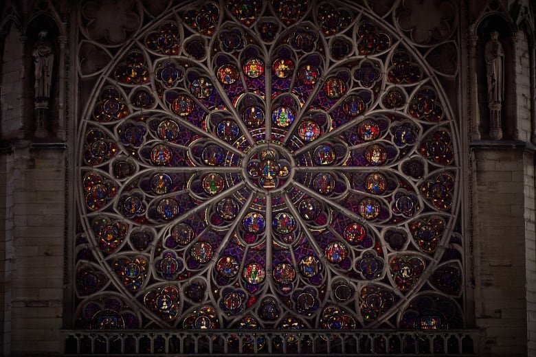 An ornate mural inside a church is shown.