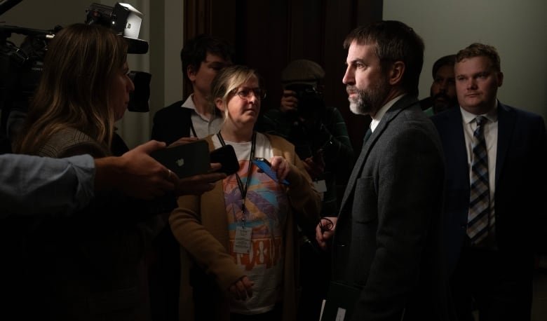 A politician answers questions from the media.