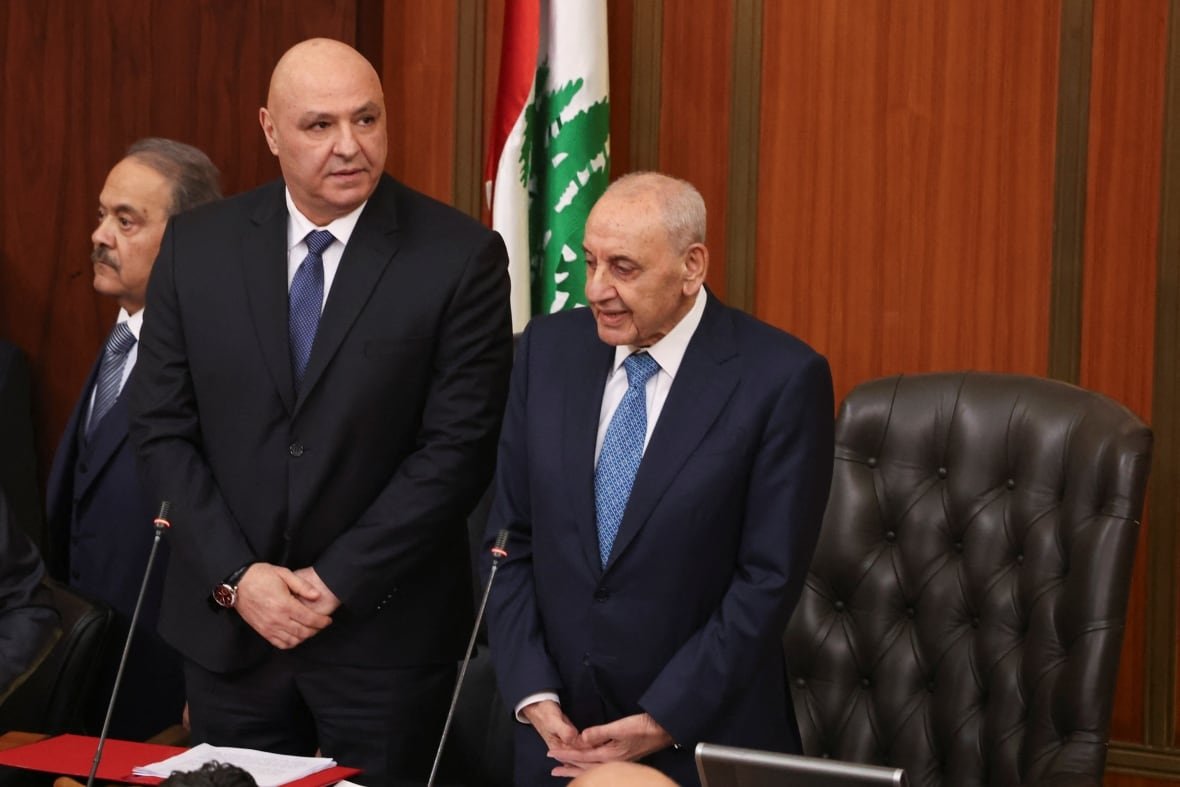 lebanon-politics-presidency-2 Two men stand inside a parliament building.