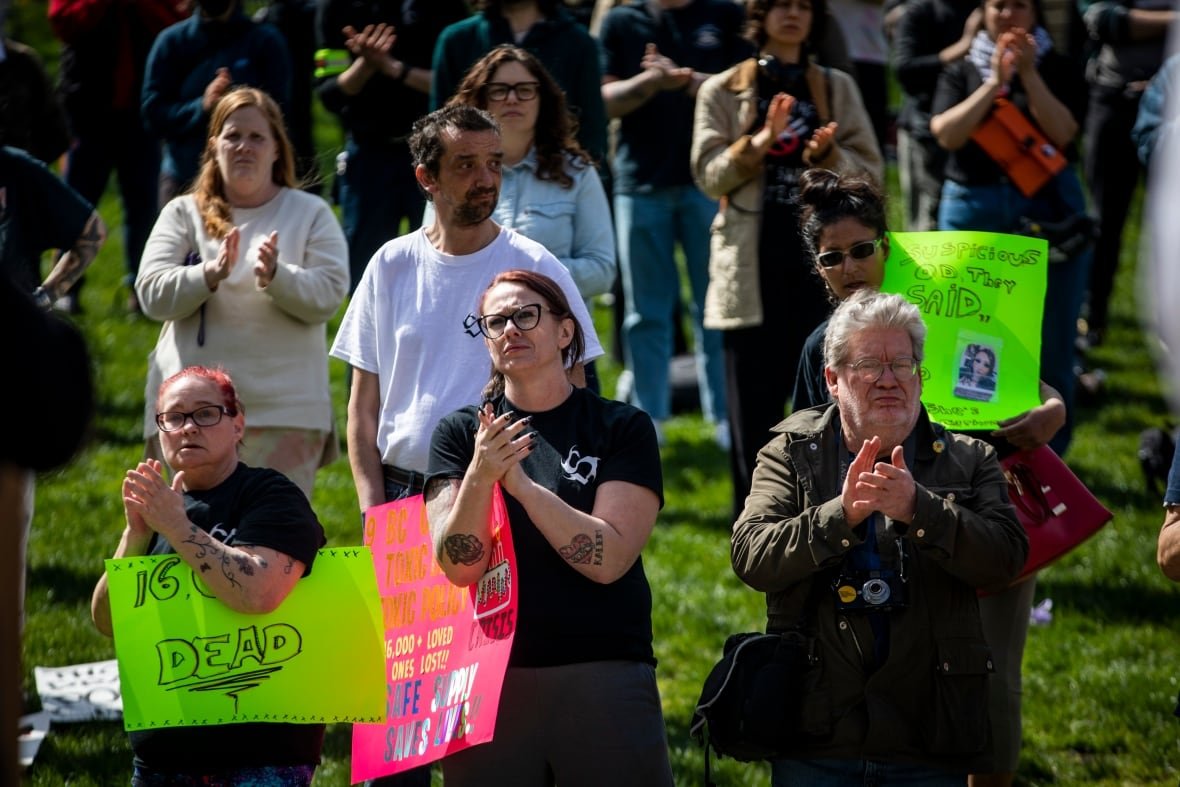9th-anniversary-drug-crisis-1 A crowd of people applaud at a rally in Vancouver commemorating the ninth anniversary of the toxic drug crisis public health emergency.