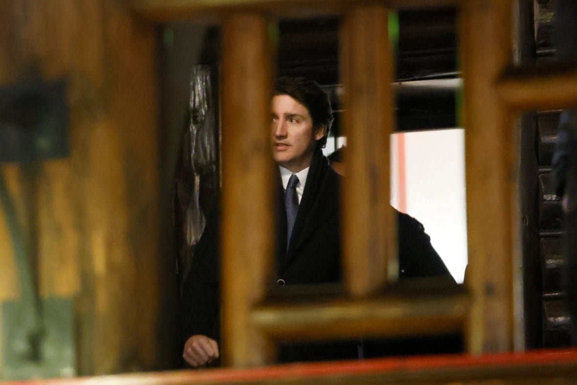 canada-politics-2 A man seen behind wooden beams