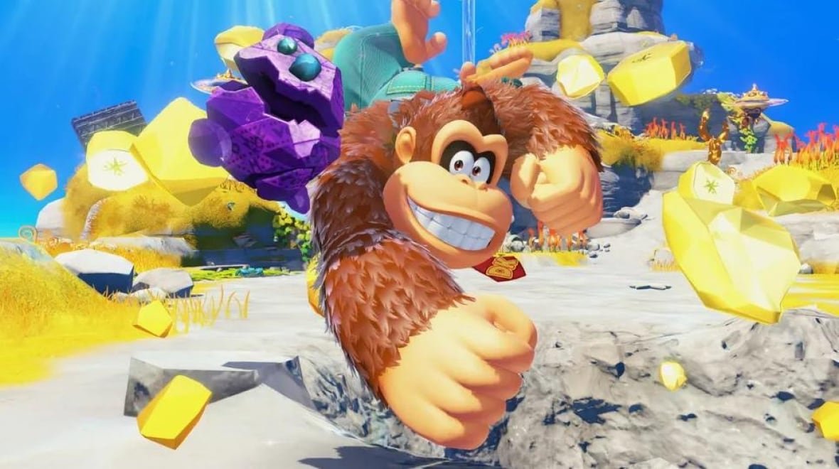 donkey-kong A cartoon ape is swinging a large fist and smiling in a screenshot of gameplay.