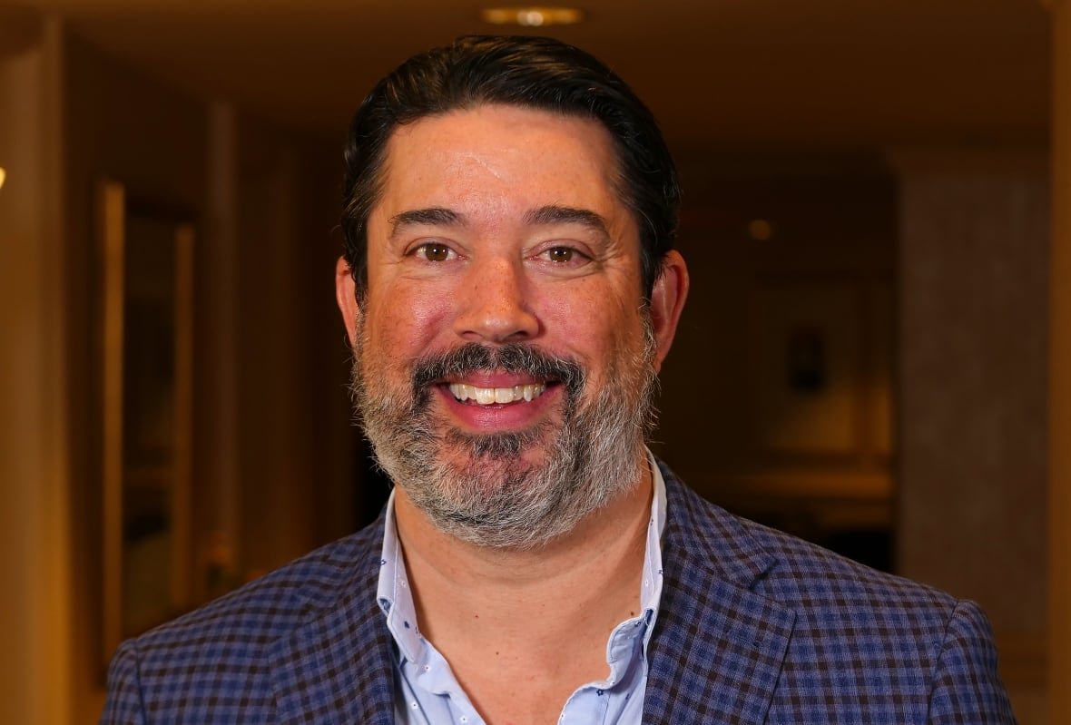 dr-gavin-parker Man with a beard smiling