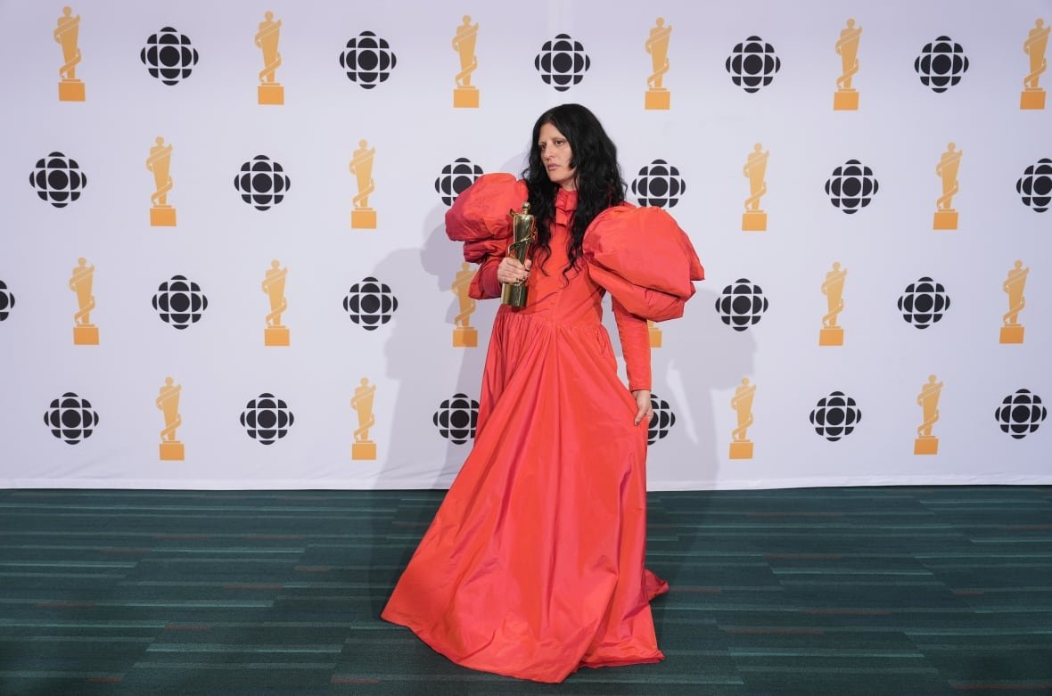 music-juno-awards-20250329-14 A person poses with an award.