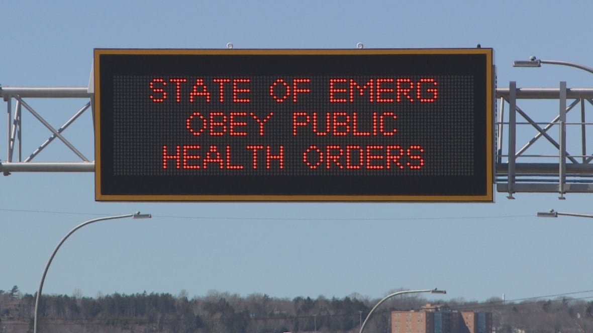 nova-scotia-state-of-emergency-road-sign A billboard says 'State of emerg obey public health orders.'