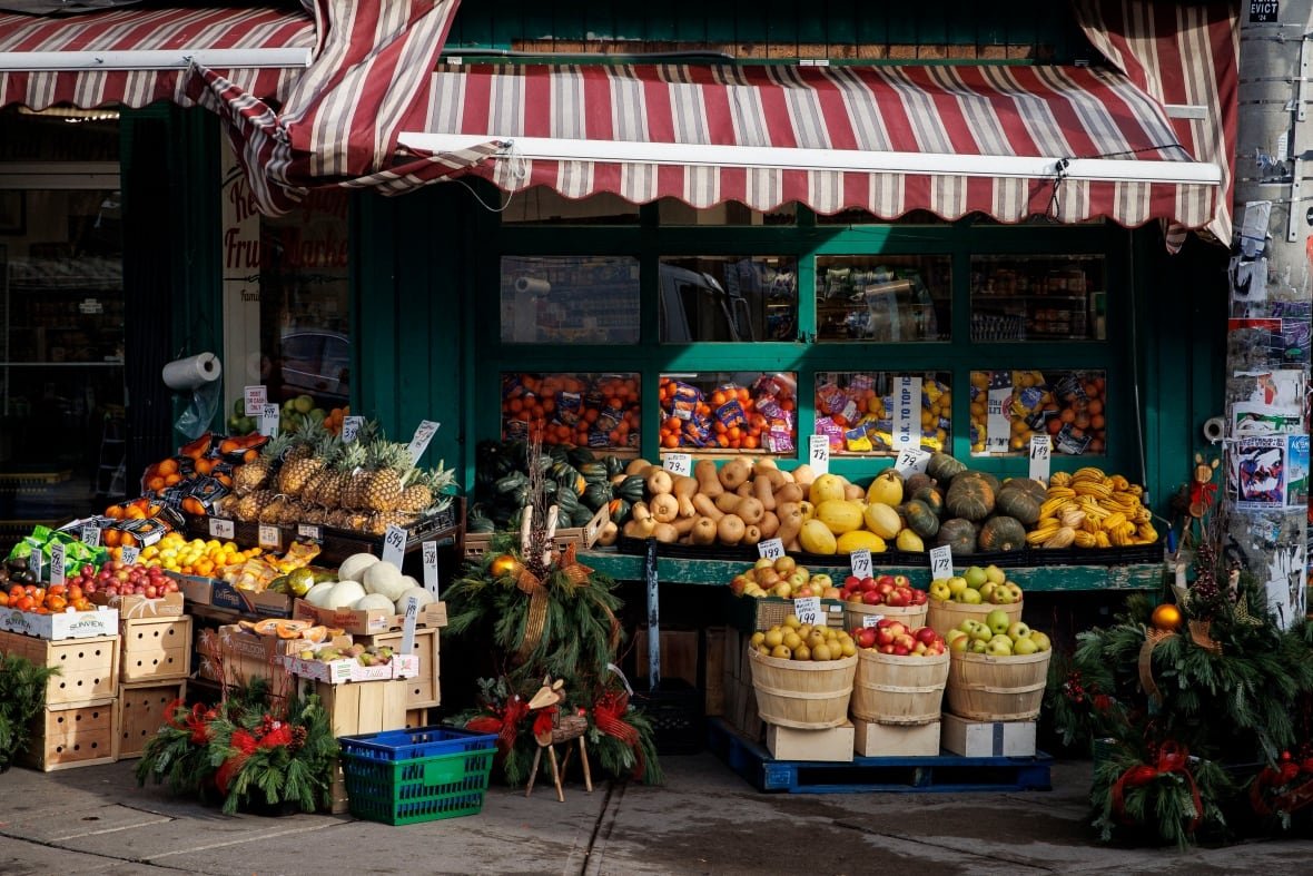 produce-for-sale-in-toronto-s-kensington-market Produce sits on stands outside a Toronto market.