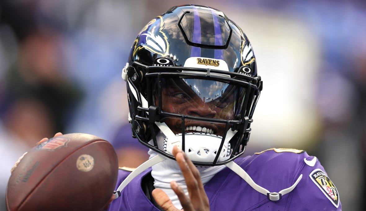 2190982287 A quarterback warms up before a game.