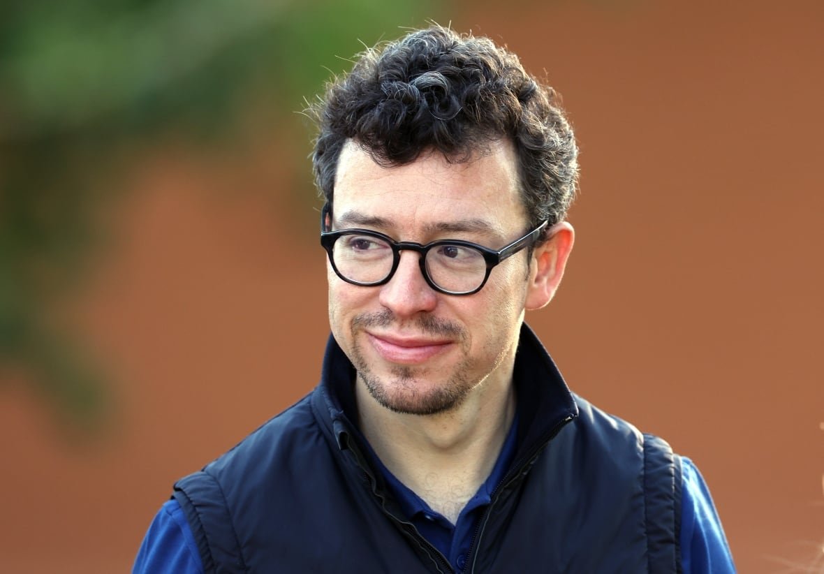 duolingo A man in glasses and a vest