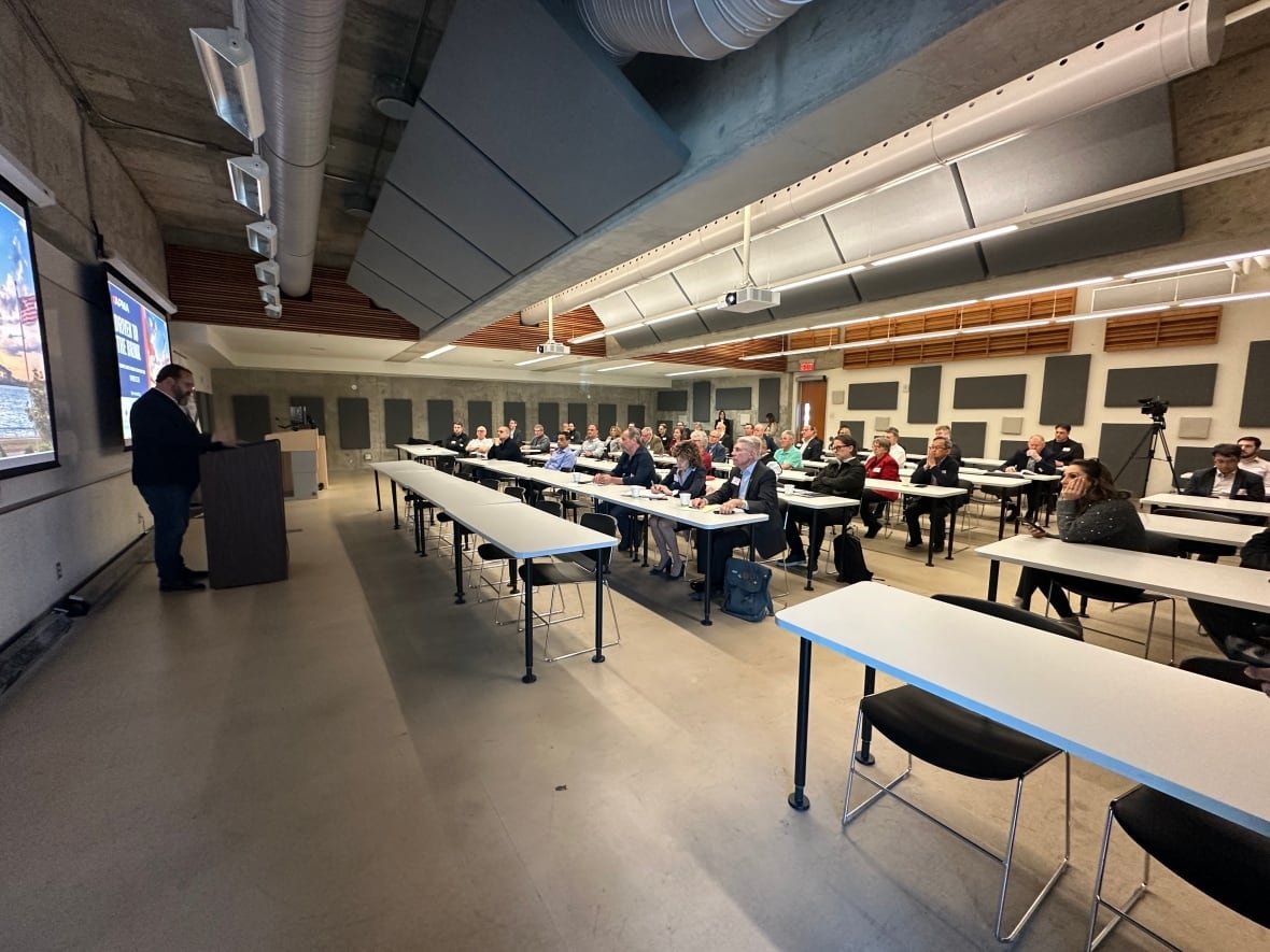 flavio-volpe-at-uwindsor-1 A man speaks to a classroom of people
