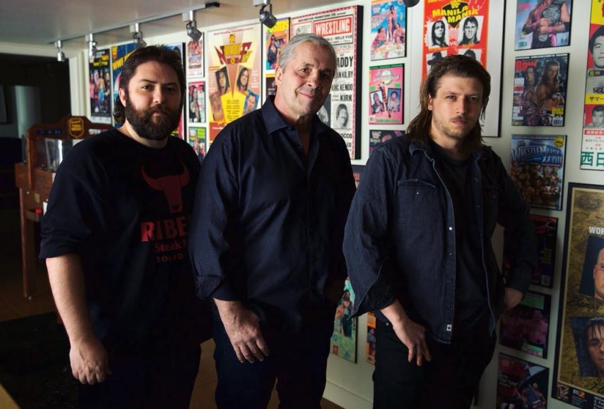 jason-eisener-bret-hart-and-evan-husney Three men pose for a photo.