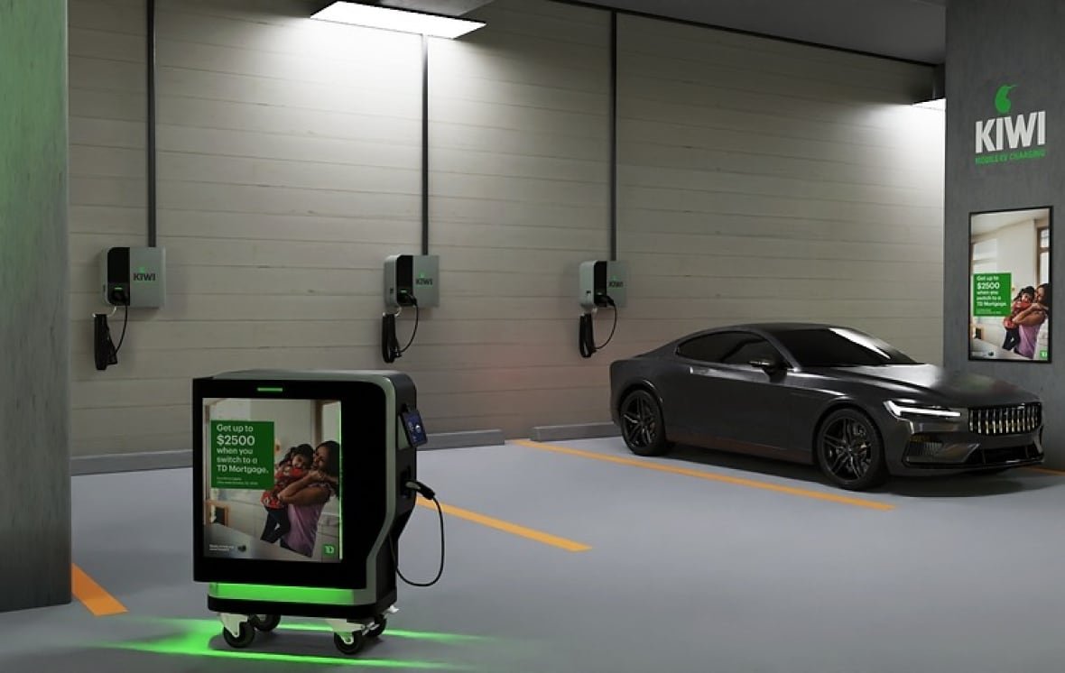 kiwi-charge-1 A black car is parked in an underground parking lot, and rectangular wheeled robot with green lights is in the bottom left corner