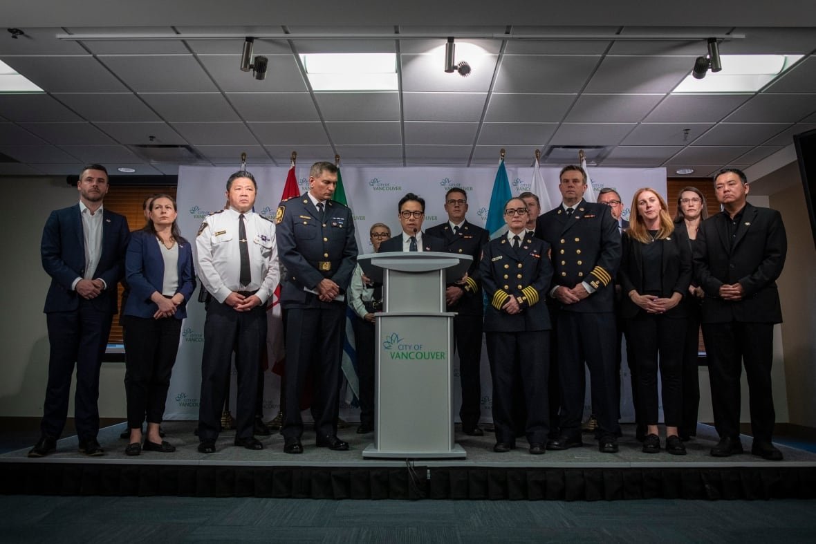 lapu-lapu-police-3 City officials stand together around a podium.