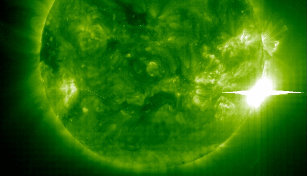 sun-1 A green colourized image of the sun, with a bright white flare at the right side of the green ball.