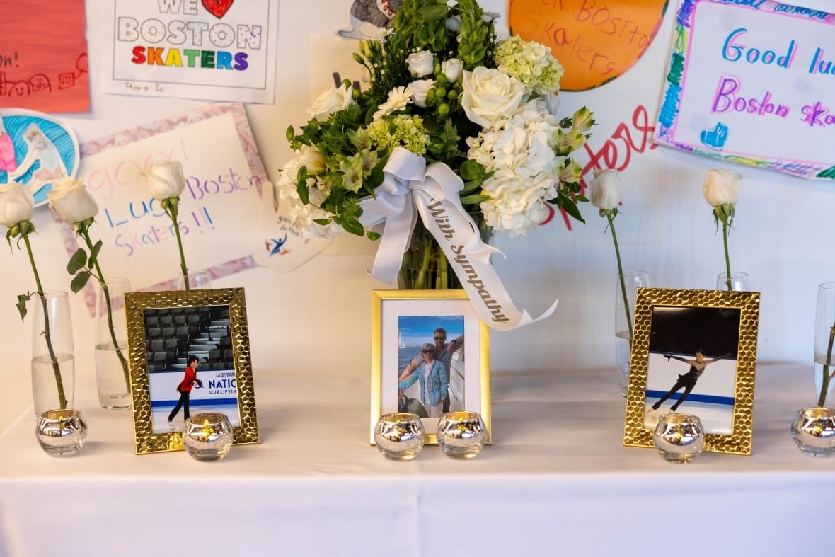 2196161388 Three separate framed portraits are shown alongside flowers and messages on cards.
