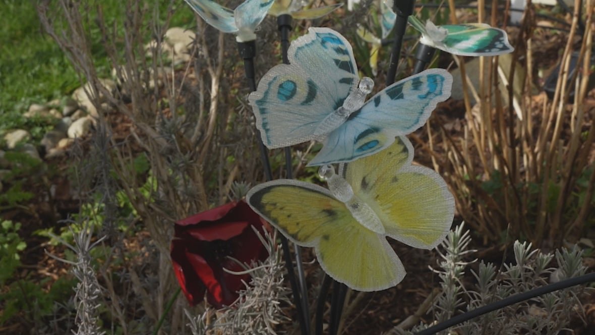 butterflies Yellow, blue and red butterfly decorations in a garden.
