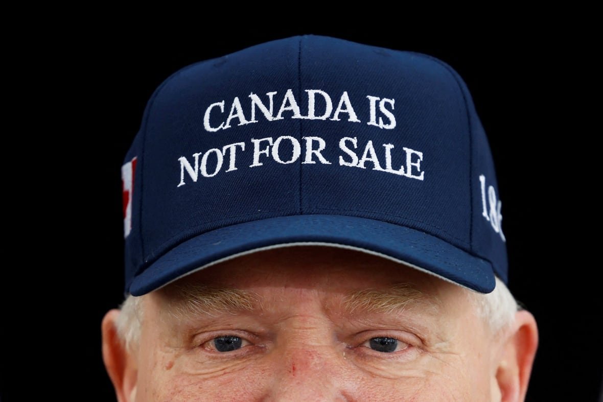 canada-hat-1 A close-up of a man wearing a hat that says Canada is not for sale