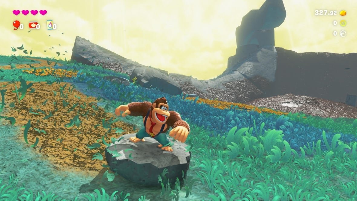 donkey-kong-bananza-1 Video game screenshot of Donkey Kong in a grassy field.