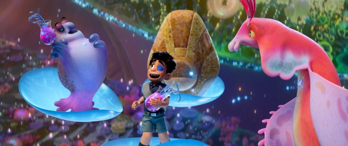 elio-1 An animated image is shown. In it, an ecstatically grinning boy stands on a floating platform. He is surrounded by aliens on similar platforms.