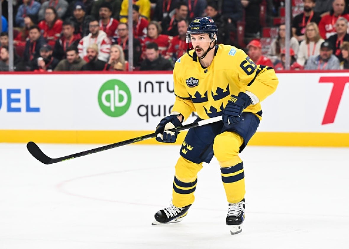 erik-karlsson A male hockey player skates.