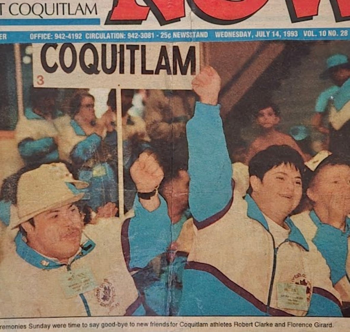 A coloured photo shows a woman with Downs syndrome dressed in a blue and white uniform with her fist raised in the air in jubilation. A man beside her dressed similarly holds a sign that says 'Coquitlam.'