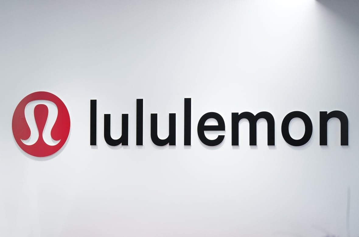 A sign on a wall reads, 'lululemon.'