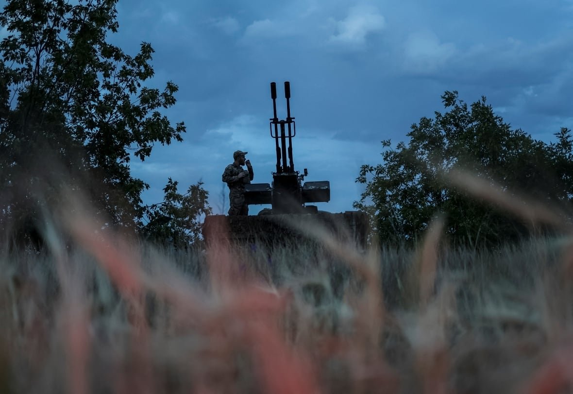 ukrainian-member-of-mobile-air-defence-unit A Ukrainian soldier watches for incoming Russian drones, in the Kherson region, in June 2024.
