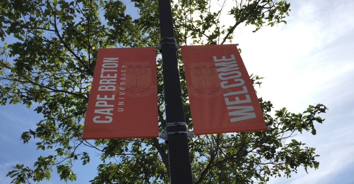 One orange banner says Cape Breton University, and another next to it says welcome.