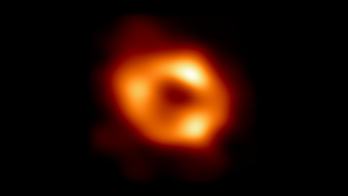 first-image-of-milky-way-black-hole An orange ring with three bright areas capture the black hole at the centre of our galaxy.