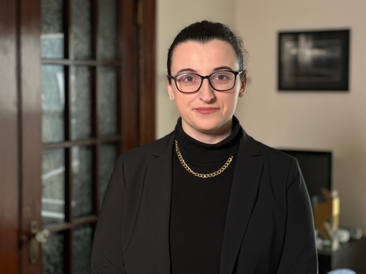 emma-arnold Portrait of a woman in black attire