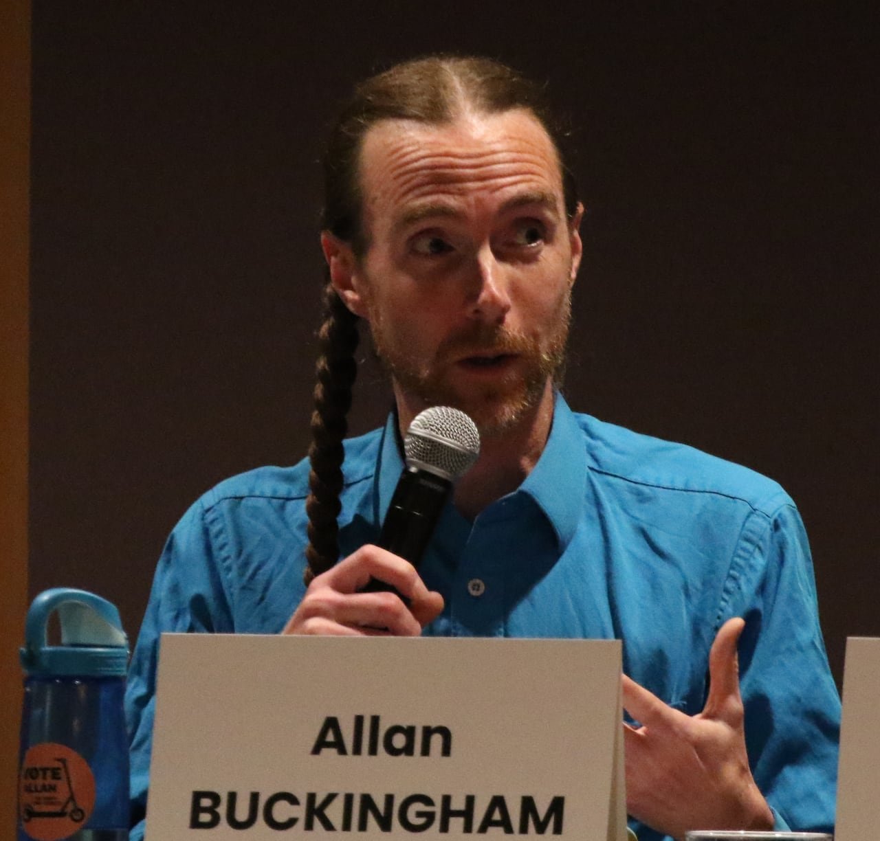 A council candidate addressing an audience.